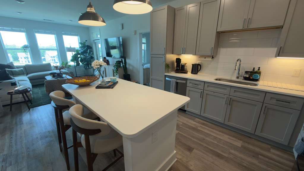 Clean open-concept kitchen and living room in an Orlando home